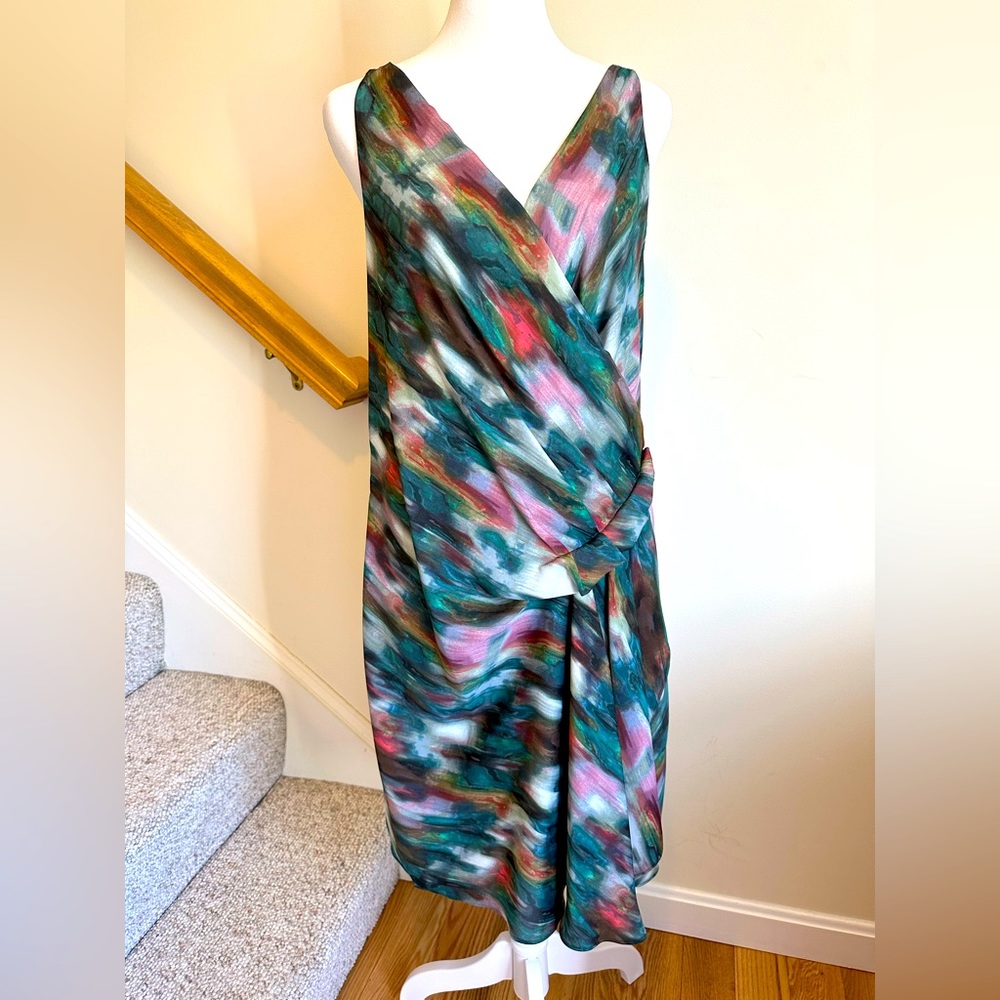 Rachel Roy watercolor with green, pink, cream colors. Size large, accent zipper.
